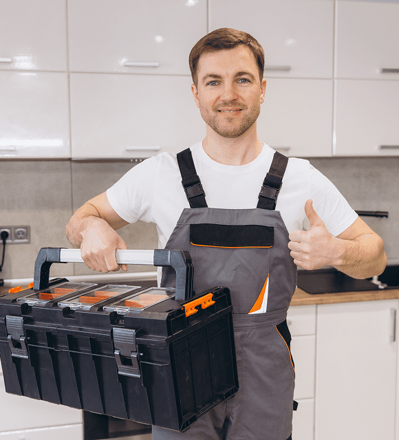 Man holding toolbox, giving thumbs up.
